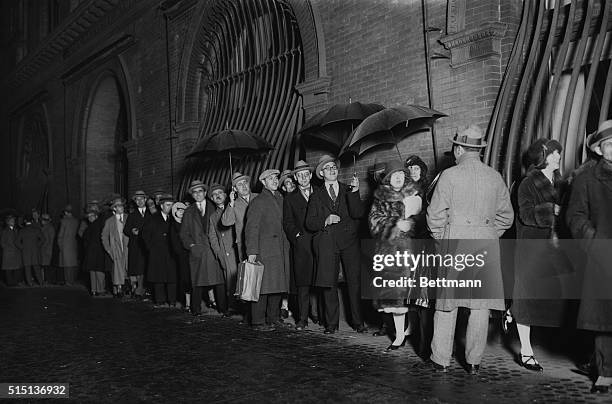 Photo shows the line of music lovers waiting to get tickets at the Metropolitan Opera House at the first performance of the season. Society as usual...