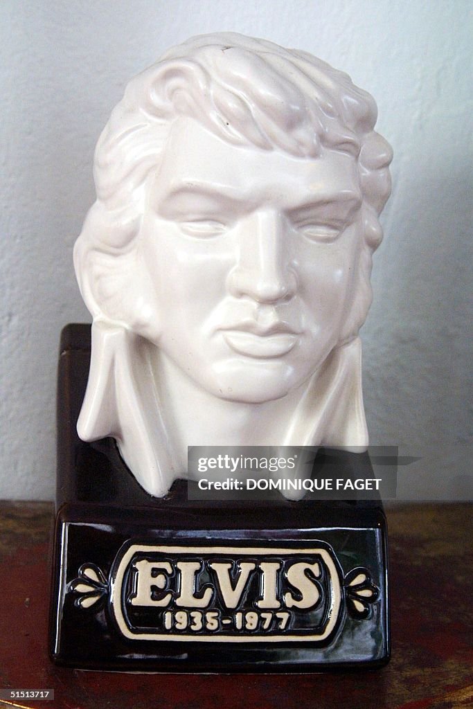 A bust dated 1988 of Elvis Presley is displayed at