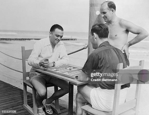 Photo shows some of the Federal Agents who are in Miami, Florida, to set up a new bureau of the department as they recently relaxed in the sun, while...