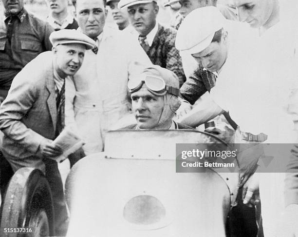 Photo shows Louis Meyer, 23 year old Californian as he appeared in his Miller Special after winning the 16th annual 500 mile auto race at the...