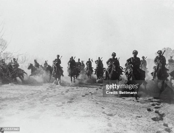 Japan Uses Cavalry for Quick Advance. A troop of Japanese cavalry is pictured advancing toward the Chinese lines along the Tientsin-Pukow railway....
