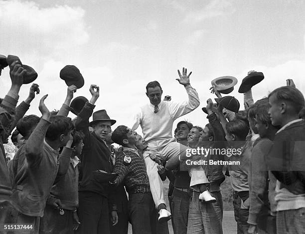 Caddies carrying Sam Snead on their shoulders after his victory in the driving contest at the Pittsburgh Field Club. Snead beat out the most powerful...
