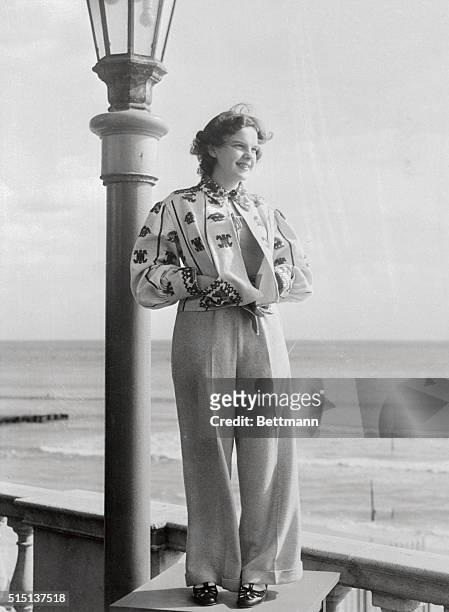 Judy Garland, the M-G-M starlet, wears a peasant blouse with beige trousers at the Roney Plaza Cabana Sun Club here, where she was a guest during her...
