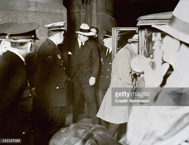 Chicago gang leader Al Capone, leaving municipal court following Judge Walsh's dismissal of his petition for a parole. Capone returned to the Eastern...