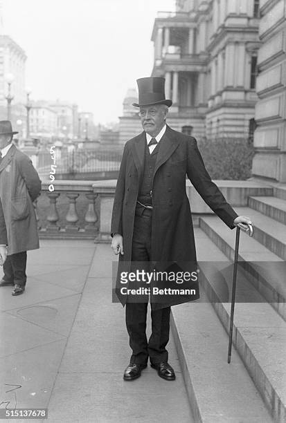 Washington, DC: British Foreign Minister Arthur James Balfour is shown wearing a very formal suit with a top hat and a long jacket. He also holds a...