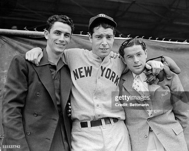 The DiMaggio brothers, Vince, of the Cincinnati Reds; Joe, of the New York Yankees, and Dominic, of the Boston Red Sox, shown together at the...