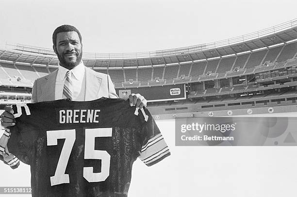 Steeler defensive tackle Joe Greene displays his number 75 jersey after he announced his retirement 2/10. Greene was the foundation used by coach...