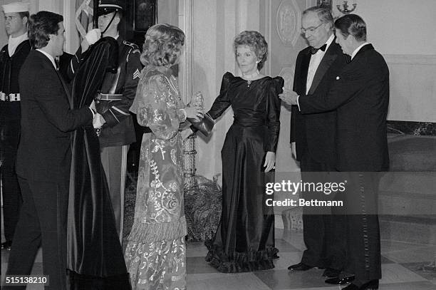 Washington, D.C.: President and Mrs. Reagan greet West German chancellor Dr. Helmut Kohl and his wife at the White House for a private dinner.