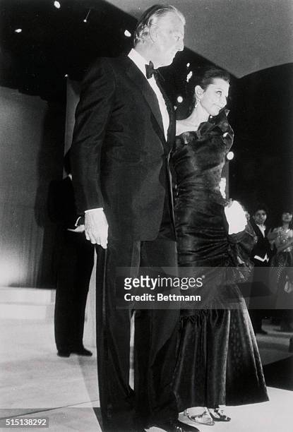French fashion designer Hubert De Givenchy escorts actress Audrey Hepburn to the Givenchy tribute at the Fashion Institute of Technology. The tribute...