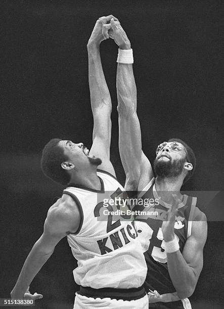 New York, NY- Bill Cartwright of the New York Knicks and Kareem Abdul-Jabbar of the Los Angeles Lakers grab hands instead of the ball, March 4. The...