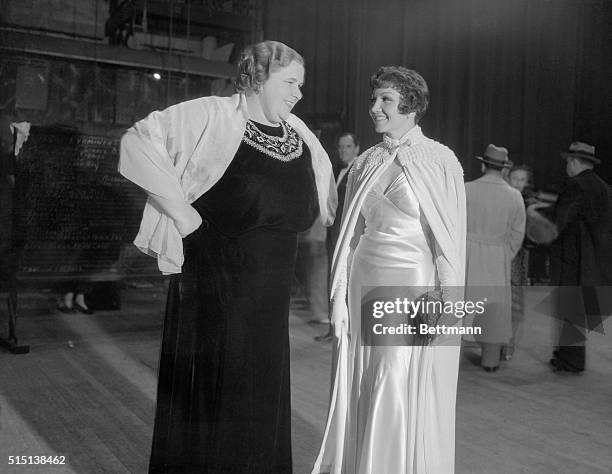 Genial Kate Smith of radio fame, and Claudette Colbert seen at the Christmas benefit show staged by a Los Angeles newspaper at the Shrine Civic...