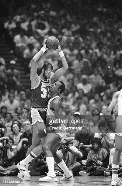 Philadelphia, PA- Sixers' Darryl Dawkins runs into Lakers' Kareem Abdul-Jabbar in the third quarter in Philadelphia 6/6. The Sixers' beat the Lakers'...