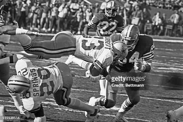 San Francisco: NFC Championship Game. Dallas Cowboys Tony Dorsett dives through the air for a short gain before being stopped by San Francisco 49ers...