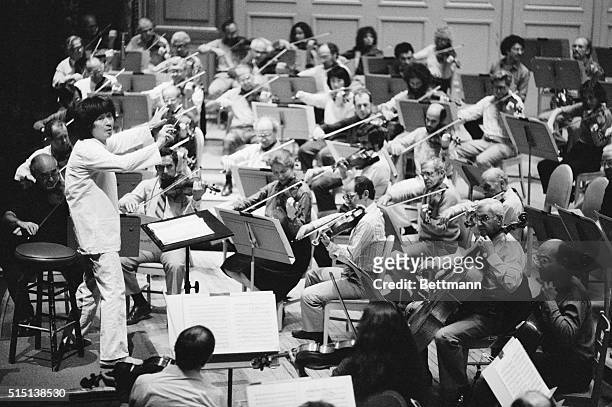 Boston: Conductor Seiji Ozawa leans back and listens to the Boston Symphony Orchestra during rehearsal for gala concert opening the symphony's second...