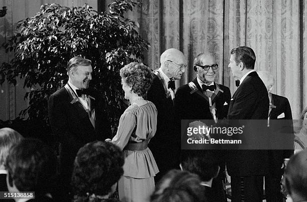 Washington: President and Mrs. Reagan honor the 1982 recipients of the Kennedy Center Honors at the White House 12/5, as big names from the world of...