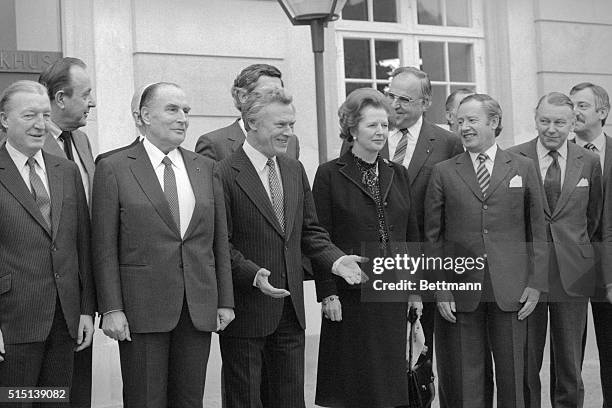 Copenhagen, Denmark: Danish prime minister Poul Schluter gestures to his press as he and other heads of state pose for photographer 12/4 morning in...