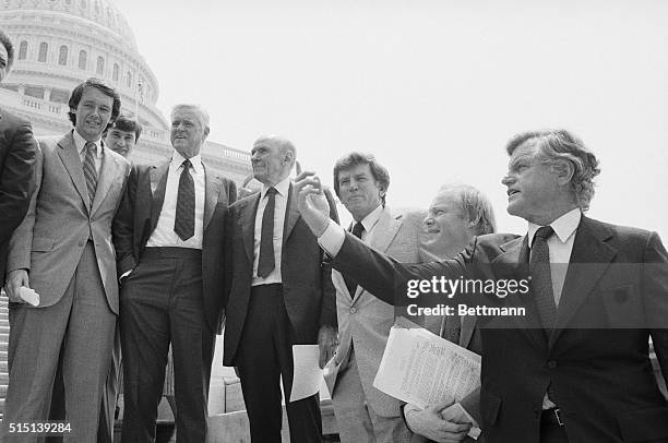 Washington, DC: Congressional supporters of the fight against the MX missile during a noontime rally on the Capitol steps, , are: Congressman Edward...