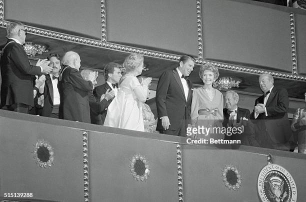 Washington, D.C.: President and Mrs. Reagan applauded by Lillian Gish and Secretary of State George Shultz at a reception at the Kennedy Center for...