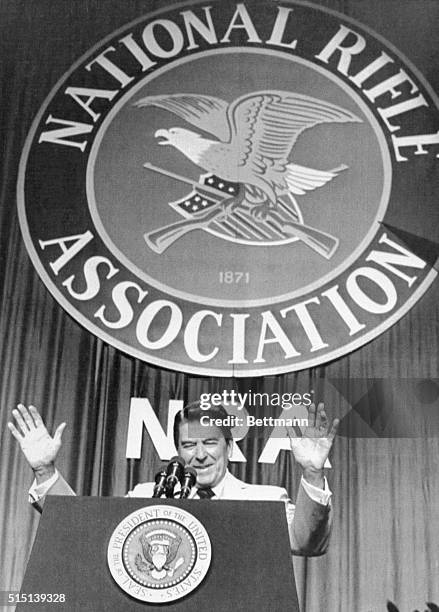 Phoenix, Arizona: President Ronald Reagan addresses members of the National Rifle Association at the Civic Center here. Reagan, the target of a would...