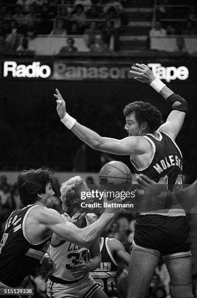 Scott Wedman of the Cleveland Cavaliers and Celtics' Larry Bird go after a loose ball during rebound action in the game in Boston Garden, 12/8. Bird...