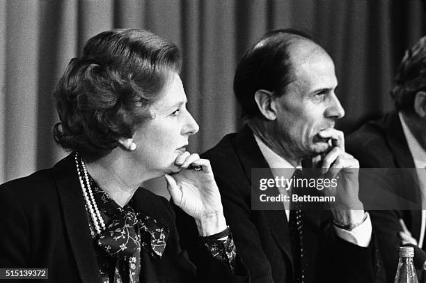 London, England- Prime Minister, Margaret Thatcher, and Employment Secretary, Norman Tebbitt, in a similar pose at a press conference. Both...