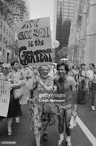 Woman expresses one point of view as she passes St. Patrick's Cathedral, background at right, during the 14th annual Lesbian and Gay Pride Parade....