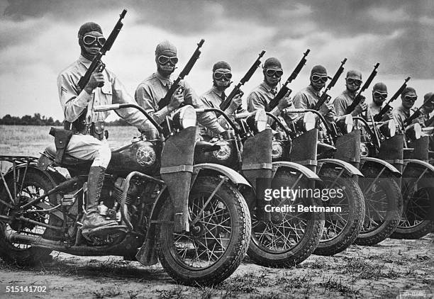 The Harley- Davidson Motor Co. Built more than 90,000 motorcycles during World War II for the armed forces. A row of Army Armored Division...