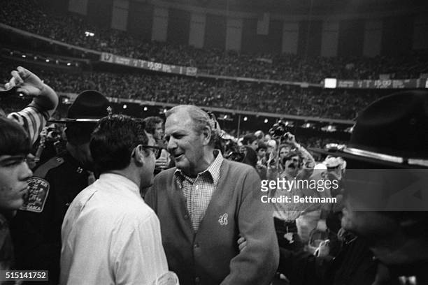 Alabama Coach Paul 'Bear' Bryant receives the congratulations of Penn State Coach Joe Paterno after the Crimson Tide defeated the Nittany Lions by a...
