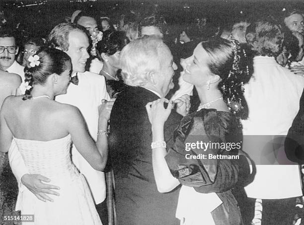 Monaco's Royals, Princess Stephanie with Prince Albert and Prince Rainier with Princess Caroline, dance during Red Cross Ball here last night, August...