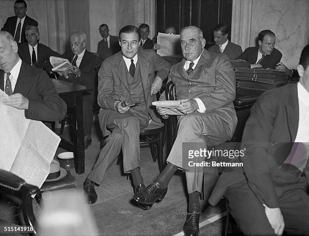 Financier and Son at Inquiry. J. Pierpont Morgan, New York financier, and his son, Junius, are seen here during the fourth day of the Senate Banking...