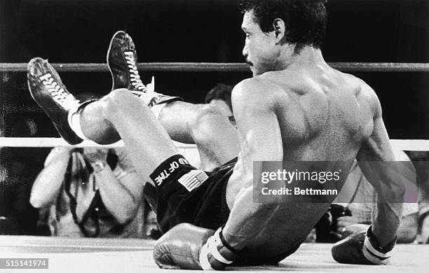 September 9, 1983-Las Vegas, Nevada: Alexis Arguello falls backward early in the first round of the WBA Junior Welterweight title bout against Aaron...