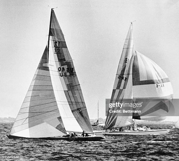 Newport, R.I.: Australia II already has her spinnaker fully set and is headed down the 2nd leg as the American 12-meter yacht Liberty still heads for...