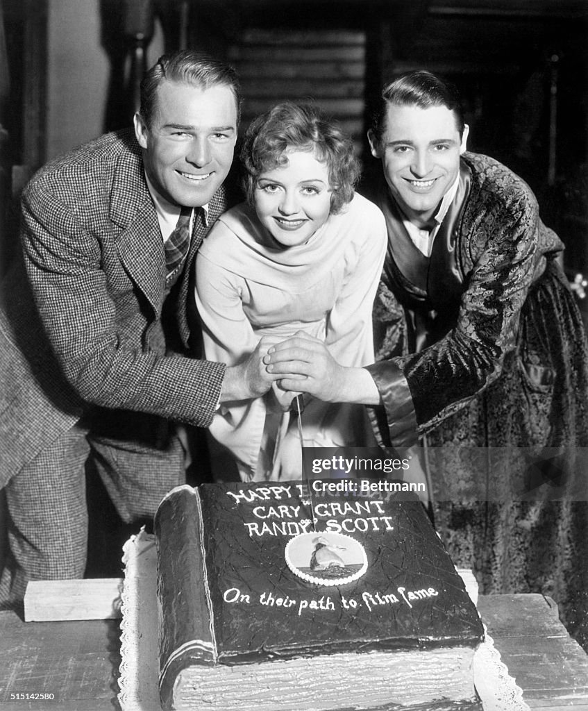 Randolph Scott, Nancy Carroll, and Cary Grant with Birthday Cake