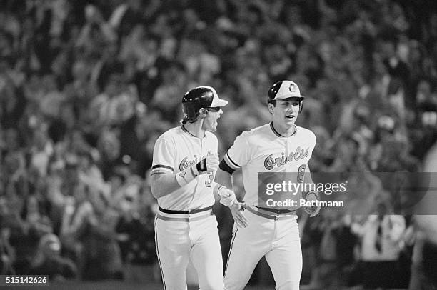 Baltimore: Orioles' Gary Roenicke rejoices October 6th as he heads for dugout after hitting 2-run homer against the White Sox. Trotting in with him...