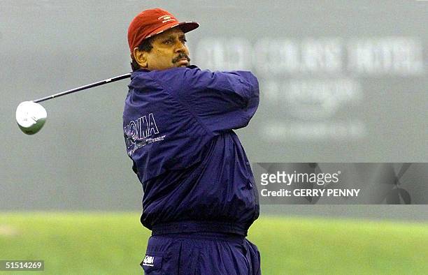 India's former cricket star Kapil Dev tees off at the 3rd on the first day of the Dunhill Links Championship 18 October 2001. The links championship...