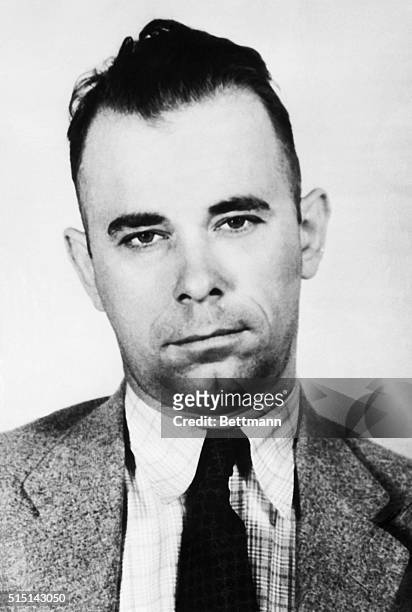 John Dillinger, ex-convict and alleged leader of a bandit ring, is being held with his sweetheart, Mary Longneck, at Dayton, Ohio, for Indiana police...