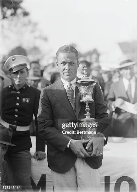 Jones defeats Homans and wins National Amateur Title, This photo shows Bobby Jones with the trophy, at Merion Cricket Club, Ardmore, Pennsylvania...