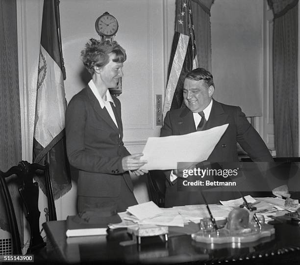 On behalf of the city of New York, Mayor F.H. LaGuardia is pictured presenting a certificate "for distinguished and exceptional public service" in...