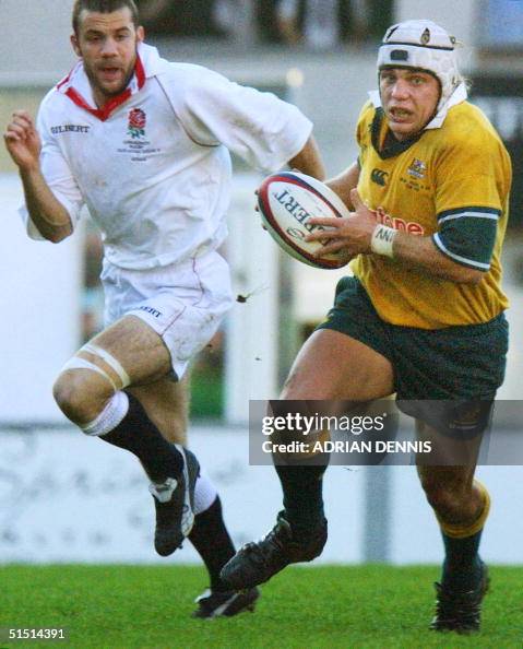 Australia's Phil Waugh runs past England's Duncan Roke during the ...