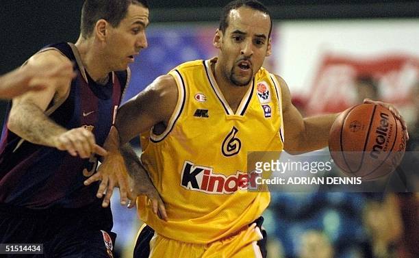 Silas Cheung of the London Towers runs with the ball against Alfons Alzamora of Barcelona during the Euroleague game at Crystal Palace in London 01...