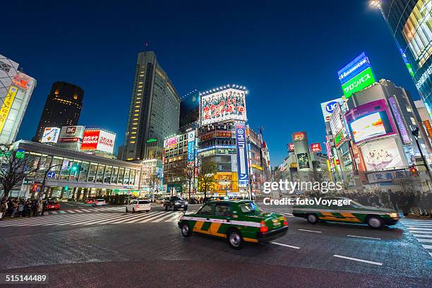 tokyo neon night illuminated crowds traffic in futuristic cityscape japan - shinjuku stock pictures, royalty-free photos & images