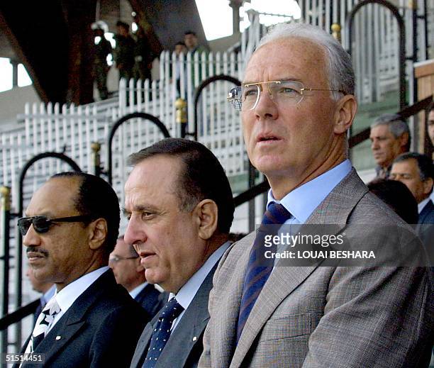 Former German football star and Chairman of Germany's Bayern Munich, Franz Beckenbauer sits next to member of the FIFA tehnical committee and member...