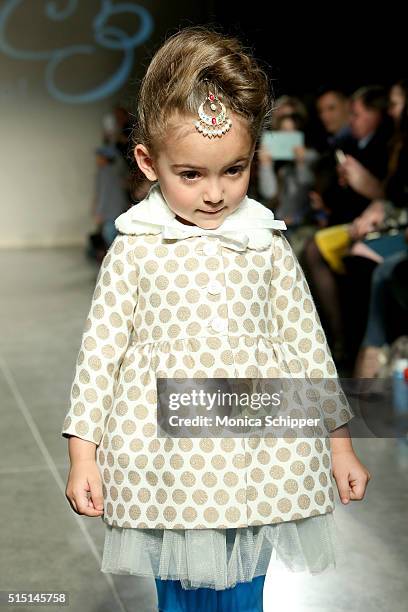 Model, wearing Baby CZ by Carolina Zapf, walks the runway at petitePARADE / Kids Fashion Week, NYC on March 12, 2016 in New York City.