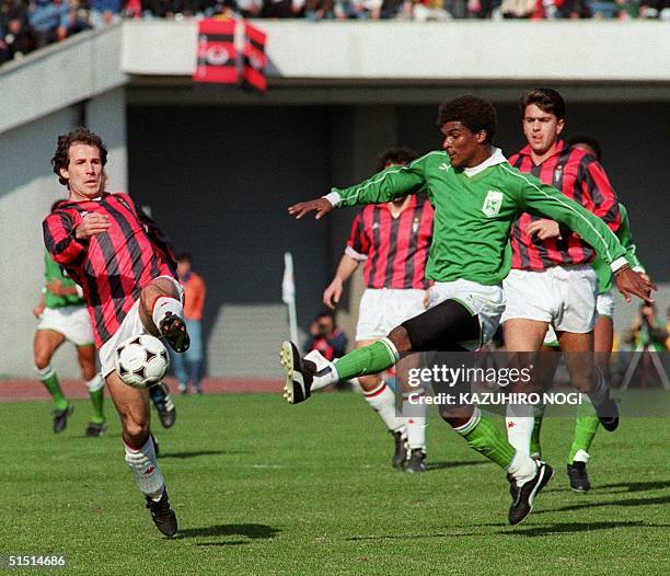 Milan captain and defender Franco Baresi intercepts the ball in front of a player from Nacional Medellin during the Toyota Cup 17 December 1989 in...