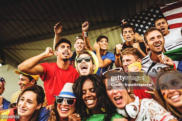 mixed national world supporter at the soccer stadium - italy v spain international friendly stock pictures, royalty-free photos & images