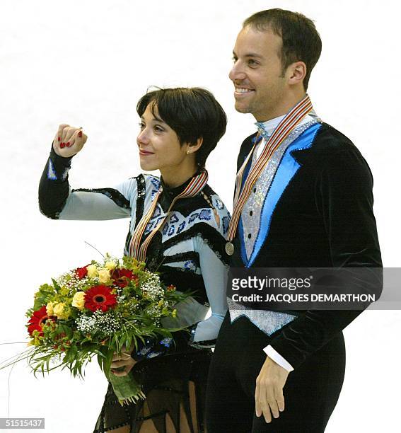 French Sarah Abitbol and Stephane Bernadis display their silver medal on the podium after the Pair's free program of the European Figure Skating...