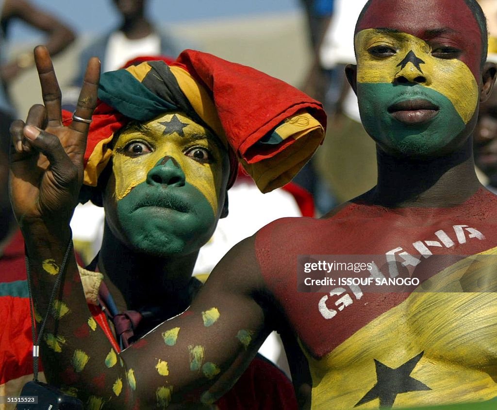 Ghana's soccer team fans pose for photographer, 21