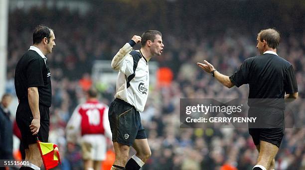 Liverpool's Jamie Carragher argues with referee Mike Riley after being sent off 27 January 2002, during their FA Cup fourth round match at Highbury....
