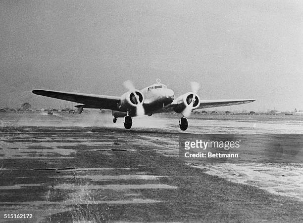 This photo shows the giant Lockheed Electra, Amelia Earhart's "Flying Laboratory," as the ship took off from Oakland Airport at Alameda, California,...