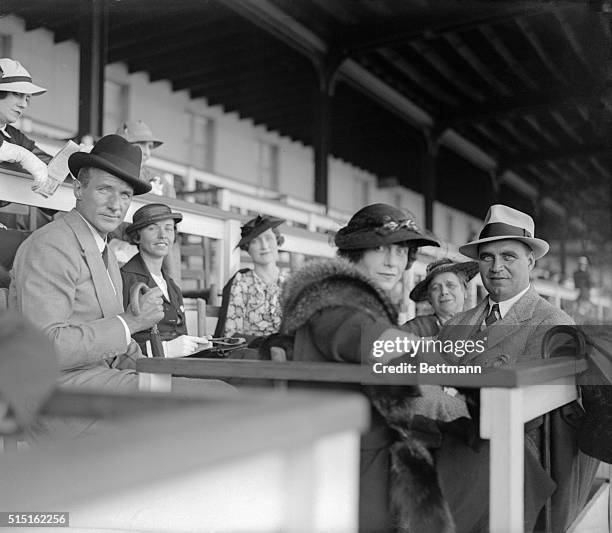 Crowds on hand day before Kentucky Derby running...Mr. And Mrs. Anthony Biddle ,. Of Philadelphia, and Joseph Cunningham, were in the social register...